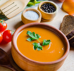 Pumpkin soup served on the table in bowl