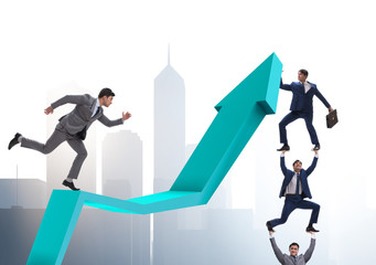 Obraz premium Businessman supporting growtn in economy on chart graph