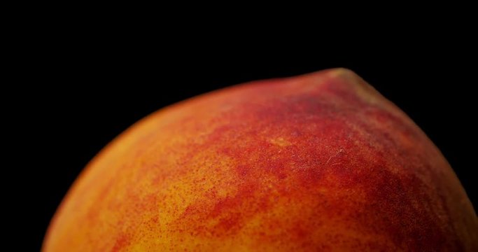 Delicious ripe peach. Macro shooting, the fruit moves around its axis.