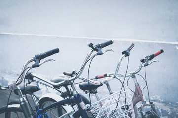 Close Up Of Bicycles On Parking. Close Up Of Bicycle handlebars. selective focus on the steering wheel