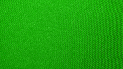 Dense light green fabric texture.Background of bright green fabric.