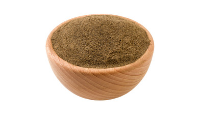 milled or ground black pepper in wooden bowl isolated on white background. 45 degree view. Spices and food ingredients.