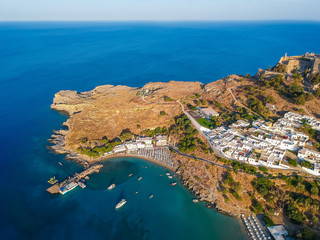 Aerial birds eye view drone photo of village Lindos, Rhodes island, Dodecanese, Greece. Sunset...