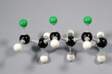 Molecule model of a part of a PVC string. Black is Carbon, green is Chlor, white is Hydrogen