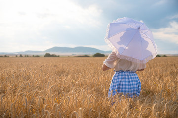 Girl  in a field of wheat