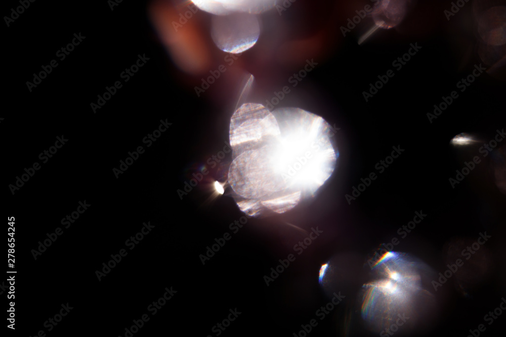 Aufkleber lens flare. light over black background. easy to add overlay or screen filter over photos. abstract 