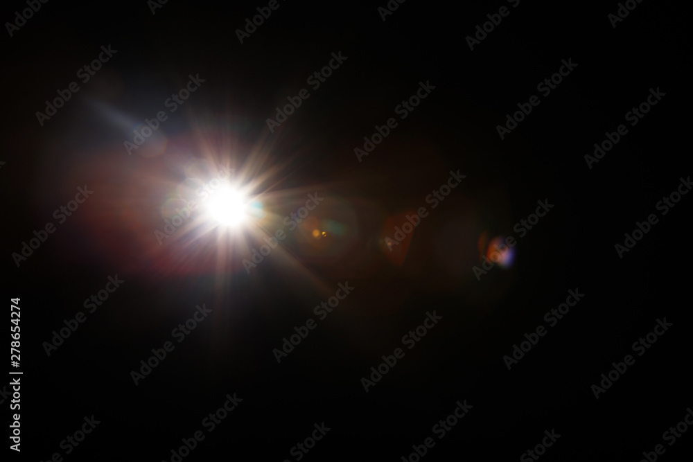 Poster lens flare. light over black background. easy to add overlay or screen filter over photos. abstract 
