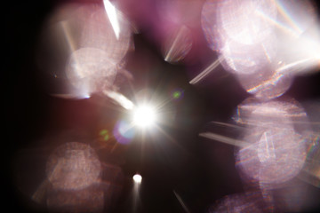 Lens Flare. Light over black background. Easy to add overlay or screen filter over photos. Abstract...