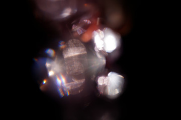 Lens Flare. Light over black background. Easy to add overlay or screen filter over photos. Abstract...