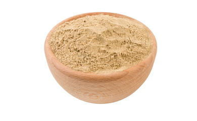 cardamon powder in wooden bowl isolated on white background. 45 degree view. Spices and food ingredients.