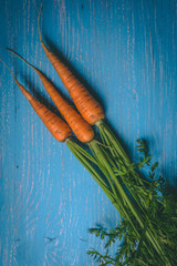 Fresh tasty carrots on a wooden rustic table. Healthy food. Vegetables.