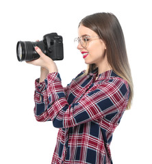 Young female photographer on white background