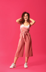 Happy young woman on color background