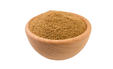 Ground or milled Caraway in wooden bowl isolated on white background. 45 degree view. Spices and food ingredients.