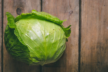 Fresh Cabbage on a wooden rustic table. Copy space. Healthy food. Raw Vegetables.