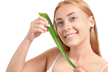 Beautiful young woman with aloe vera on white background
