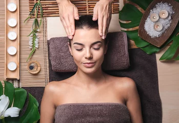 Raamstickers Beautiful young woman receiving massage in spa salon © Pixel-Shot