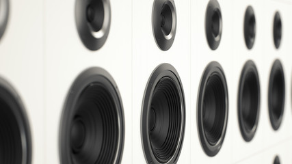 A stack of clean white painted audio speakers