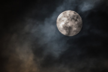 Naklejka na ściany i meble Full moon in the sky at night with clouds