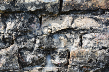 Masonry stone wall in the ancient city of side in Turkey. Natural stone background