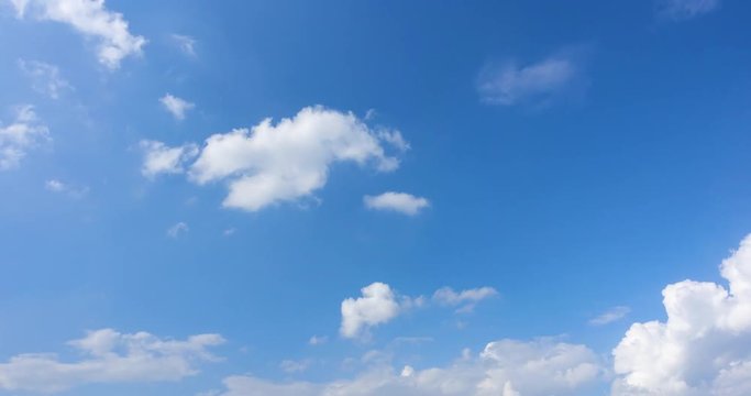 Beautiful bright clear blue sky white fluffy clouds on a clear sunny day. Royalty high-quality free stock time lapse footage of blue sky with white cloud. Time lapse of natural cloudscape background
