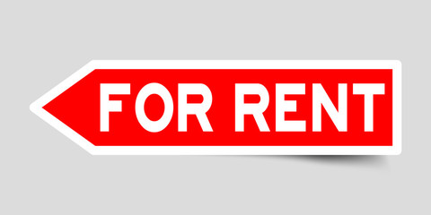 Arrow shape red color sticker in word for rent on gray background