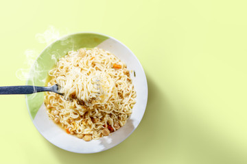 People eat the noodles with fork
