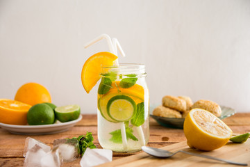 Summer refreshment, Orange, Lemon and lime infused water - still life healthy options concept image with copy space for text.