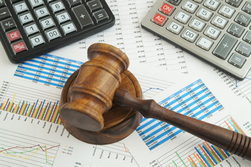 Arbitration concept, judge gavel and calculators on financial documents