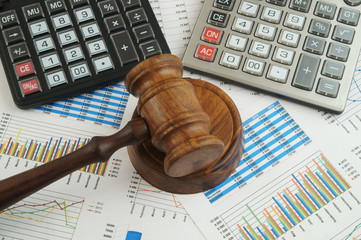 Arbitration concept, judge gavel and calculators on financial documents