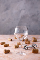 Empty wine glass. Nutrmor with a glass and wine corks. The concept of winemaking. Place under your text.