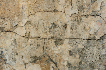 Texture of a concrete wall with cracks and scratches which can be used as a background