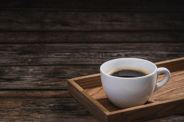 cup of coffee on wooden table