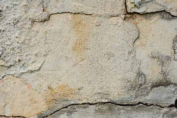 Texture of a concrete wall with cracks and scratches which can be used as a background