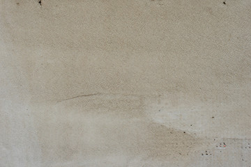 Texture of a concrete wall with cracks and scratches which can be used as a background