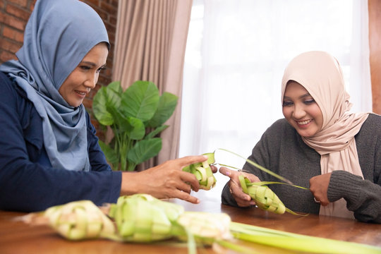 Muslim Women Make Traditional Ketupat Food For Eid Celebrations At Home