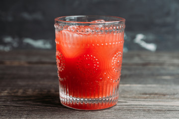 Old fashioned cherry cocktail with berries and spices. Selective focus. Shallow depth of field.