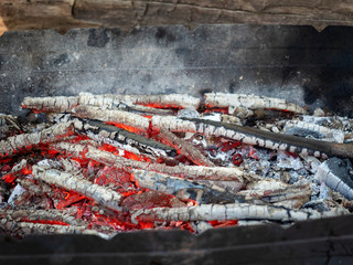  Burning coals in an iron brazier Charcoal gives heat lying in the grill