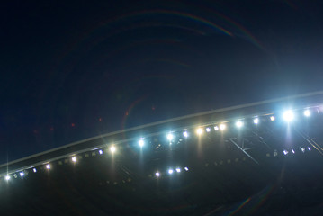Stadium lights against blue sky