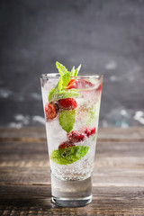 Cherry mojito cocktail on the rustic background. Selective focus. Shallow depth of field.