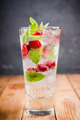 Cherry mojito cocktail on the rustic background. Selective focus. Shallow depth of field.