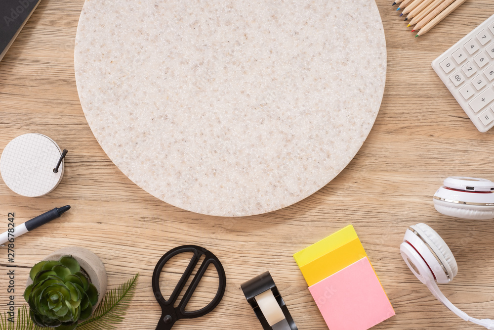 Poster office table desk top view with stationery, notebook,headphone,plant,noteapd and caculator on wooden