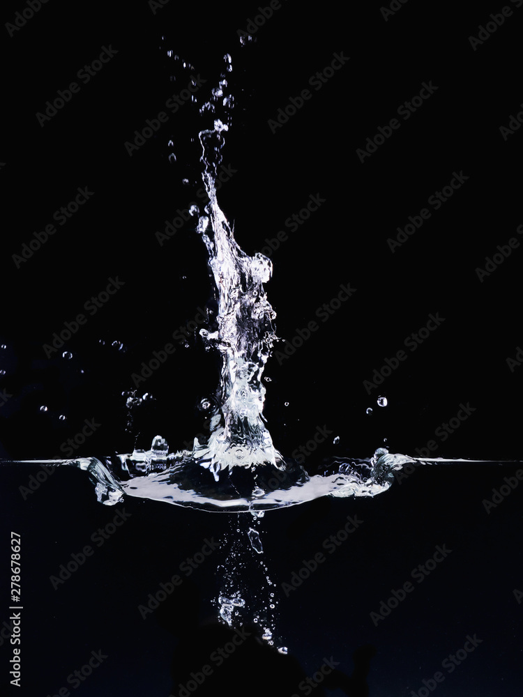 Poster explosion on water surface isolated on black background, close up view. underwater bubbles and rippl