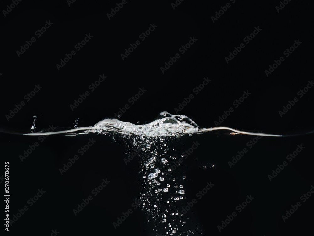 Poster water bubbles and rippling water surface isolated on black background, close up view. liquid splashi