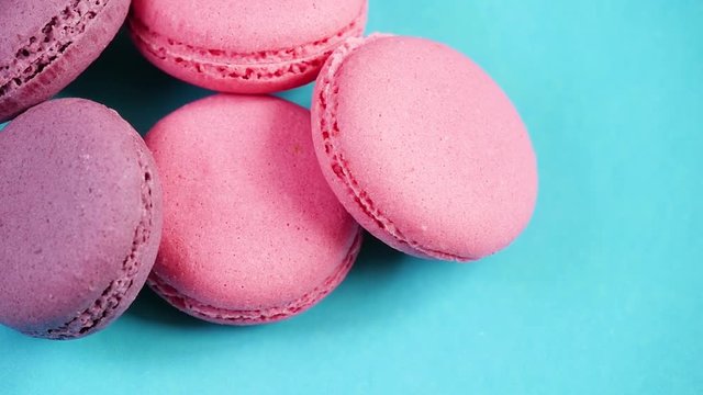 Beautiful bright cookies or macaroons on blue background. The concept of proper nutrition and overweight.