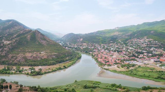Timelapse video with aerial view of Kura and Aragvi rivers confluence near the old Georgian town Mtskheta.