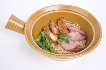 Dried egg noodles with roasted pork and fried chicken.