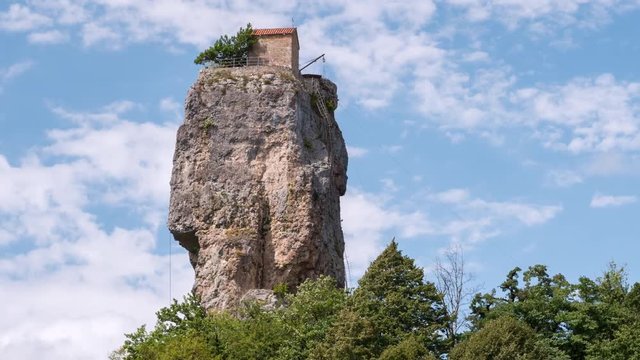 Timelapse video of touristic landmark Katskhi Pillar with ancient Orthodox church on top in Chiatura, Georgia