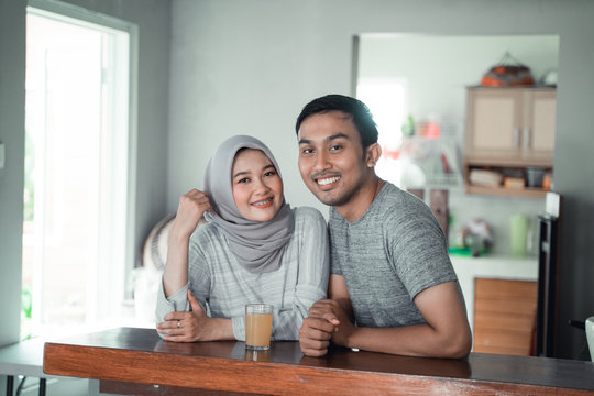 moslem couple relax sitting together in the kitchen