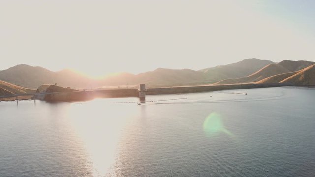 Aerial Drone Tracking Shot of a Lone Boat on a Beautiful California Mountain Lake (Lake Kaweah, Visalia, California)